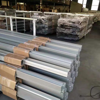 Bundles of aluminum profiles for projector mounts stored in a warehouse.