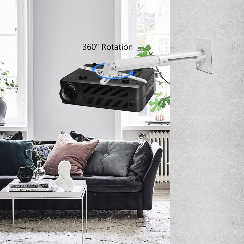 Wall-mounted black projector with 360° rotation in a modern living room.