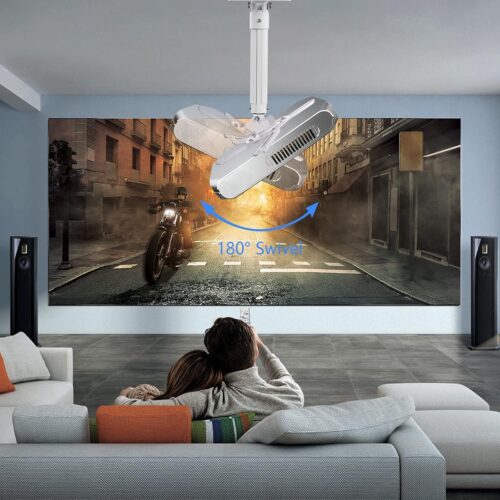 Couple watching a movie in a home theater setup with a ceiling-mounted projector.