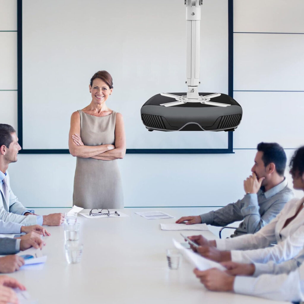 Ceiling-mounted projector above a business meeting with professionals.